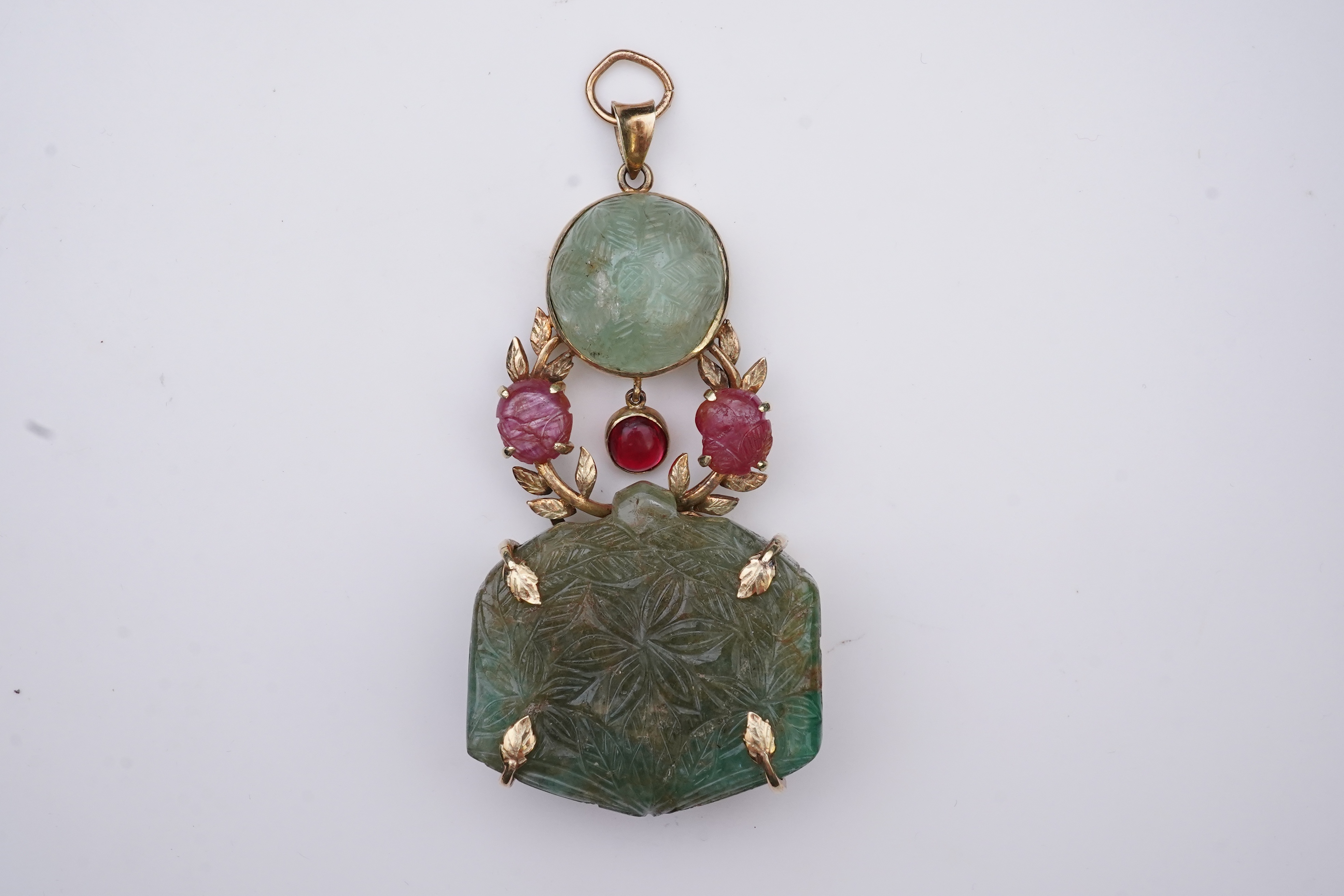 An unusual Mughal-style emerald, ruby and synthetic ruby pendant, second half 20th century